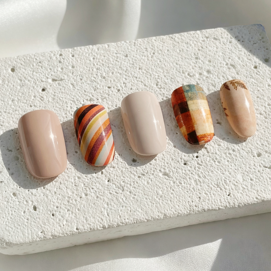 Beige and warm-toned autumn plaid press-on nails with stripes.