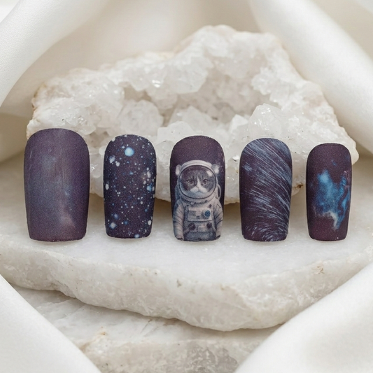 Close-up_of_starry_sky_astronaut_pet_portrait_press-on_nail_featuring_intricate_galaxy_patterns_and_sharp_detail